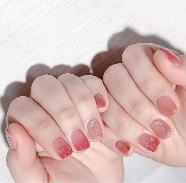 Pink and rose nail design with metallic flecks