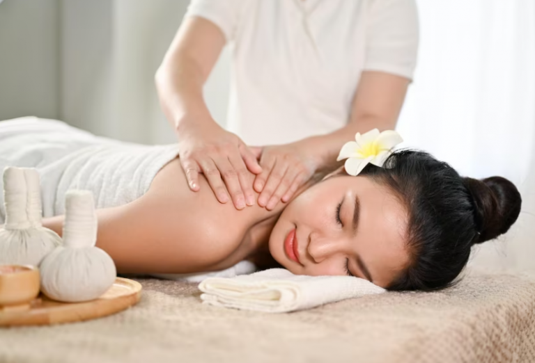 Massage therapist working on the shoulders and upper back