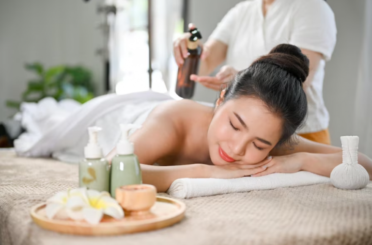 Massage therapist preparing oil for a back massage